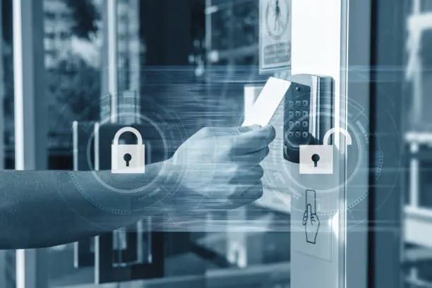 istockphoto-954913804-612x612 Hand using security key card unlocking the door to entering private building . Home and building security system